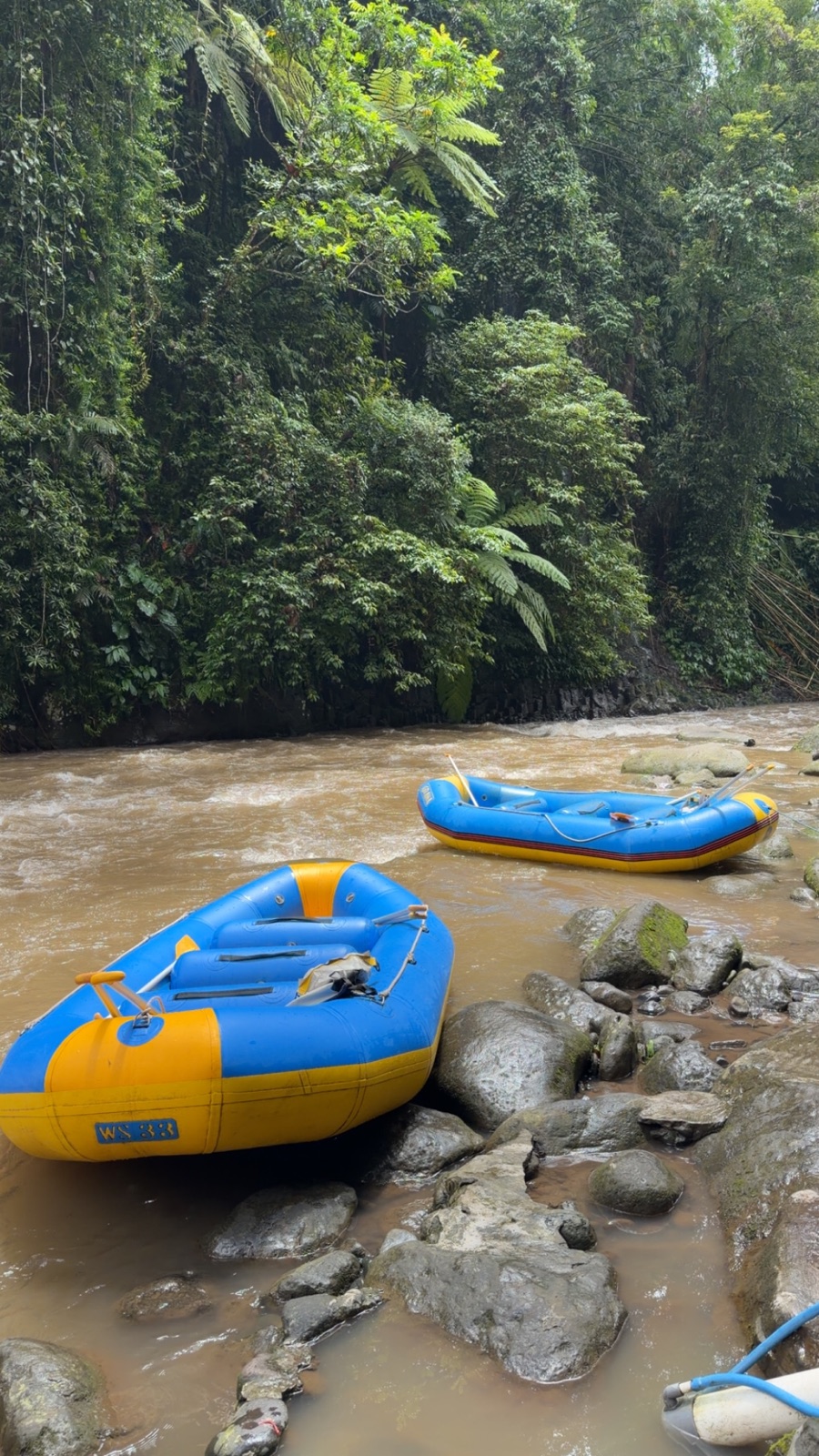 Rafting boats beside a lush Bali river