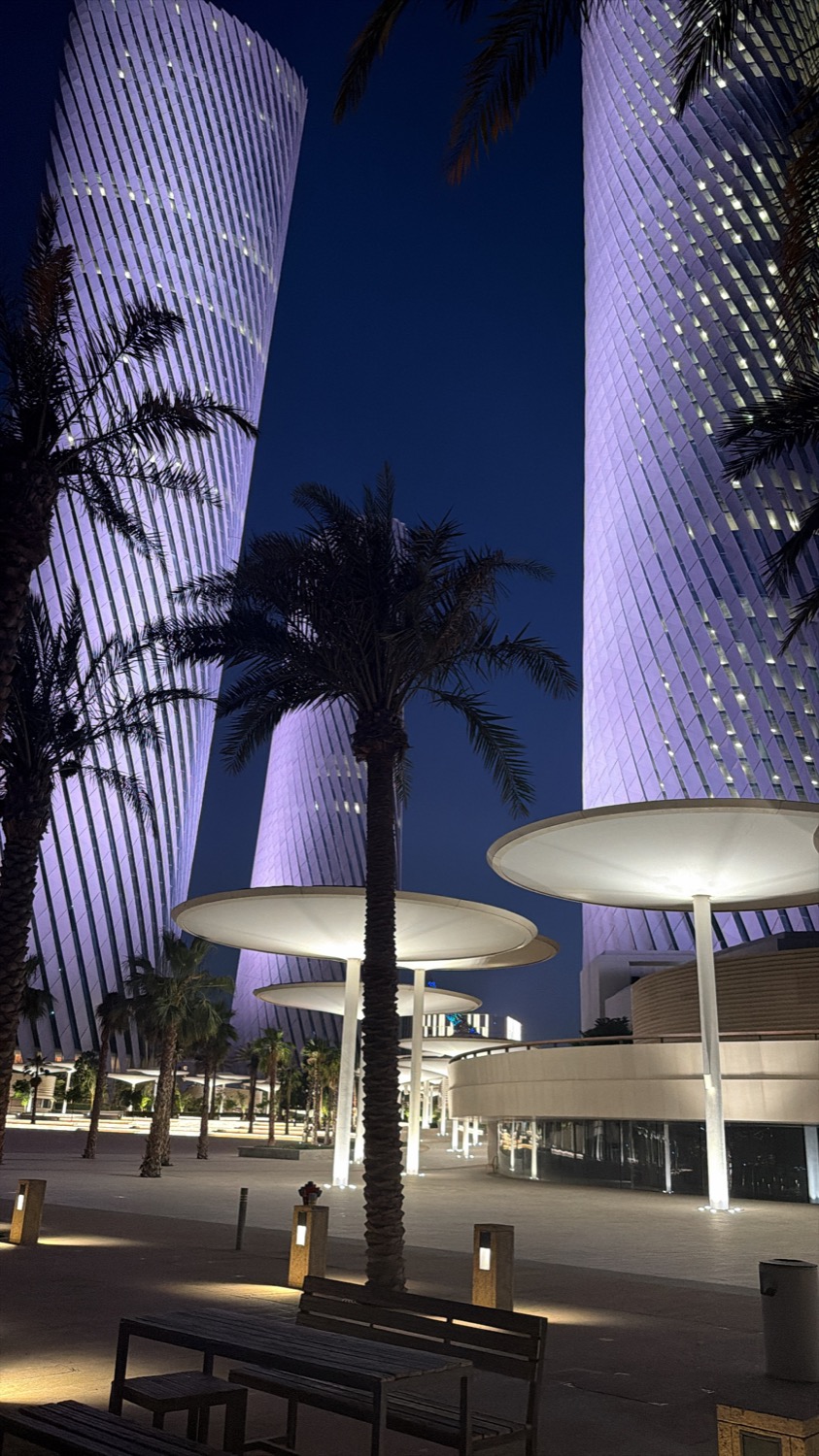Doha towers lit at night during a hosted trip