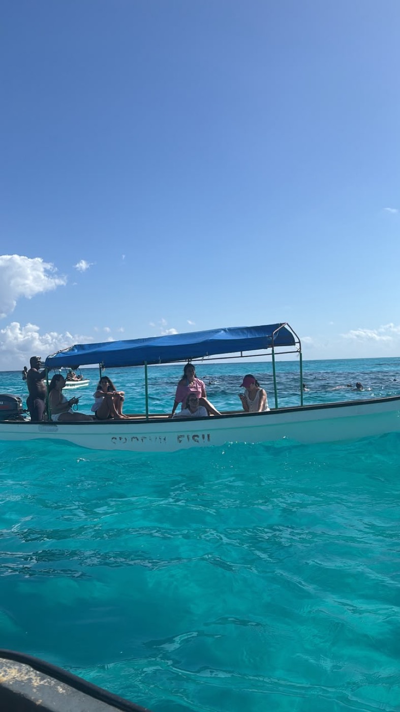 Boat floating over clear turquoise water